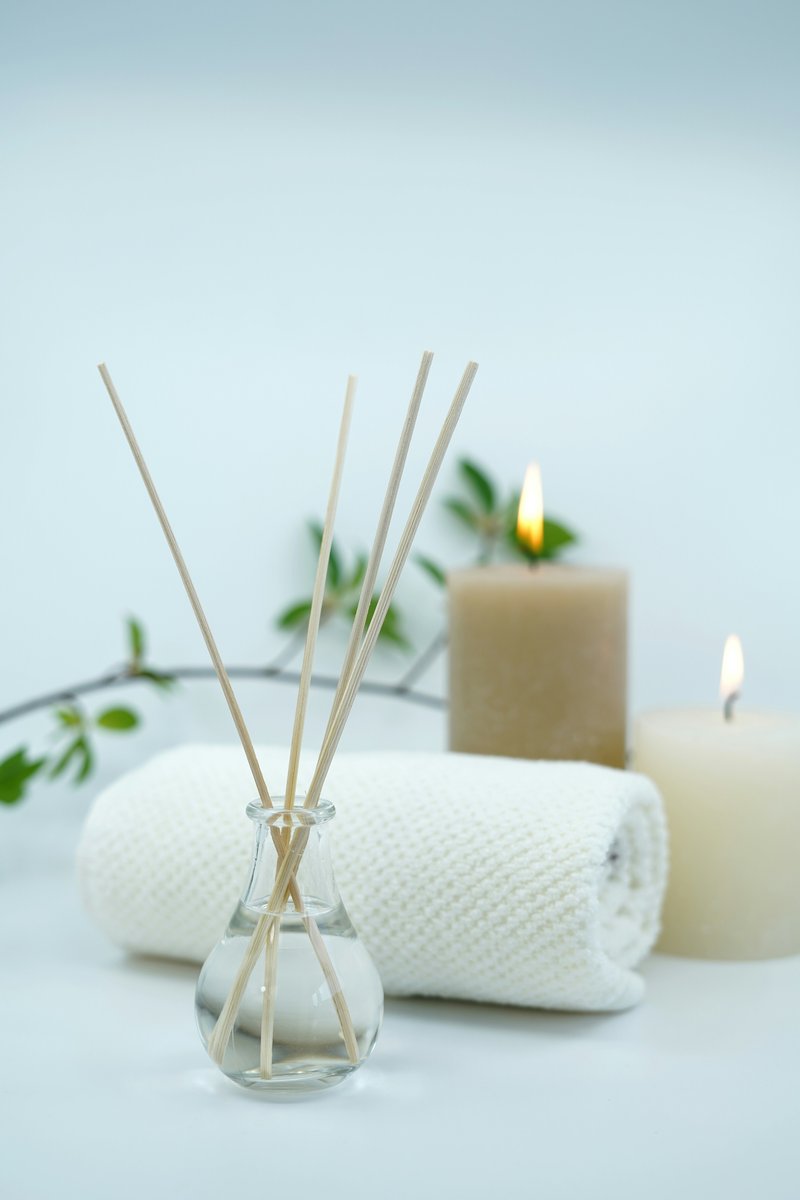 A lit candle, setting a calm and relaxing mood